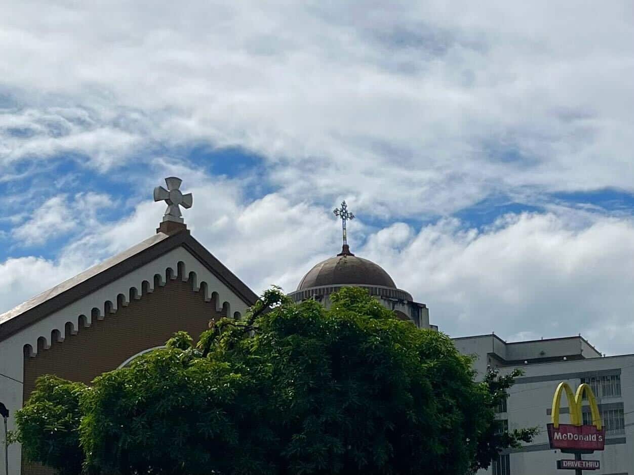 Two churches side-by-side on Earnshaw Street, Manila - plus a McDonald's.